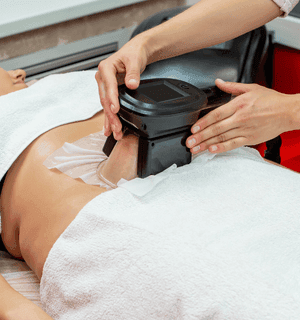 Cryoshock treatment head working on the skin of the abdomen.